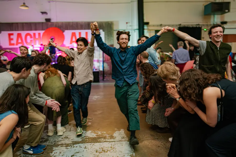 Dancers making an arch at a public ceilidh